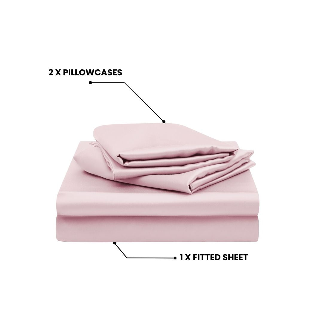 The Mynt Lab MyntFusion™ Fitted Sheet Set (3-Piece) in light pink features two pillowcases folded on top and one cooling fitted sheet neatly stacked below, with labeled indicators for each item.