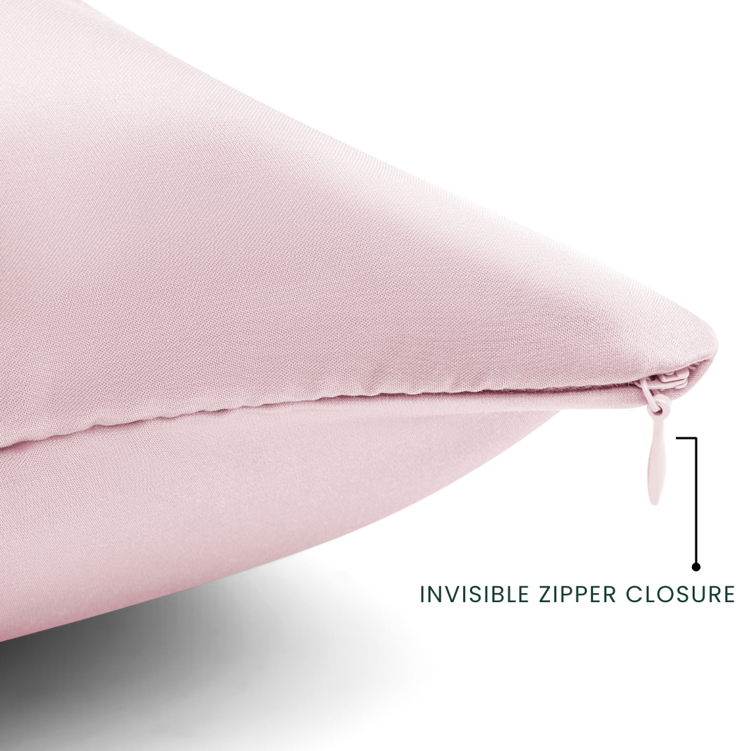 Pink pillow with an invisible zipper closure on a light gray background