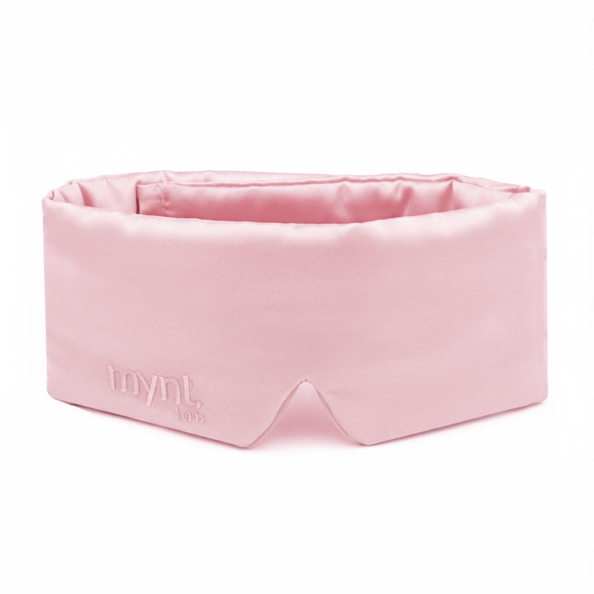 Pink sleep mask with 'mynt lab' branding on a white background
