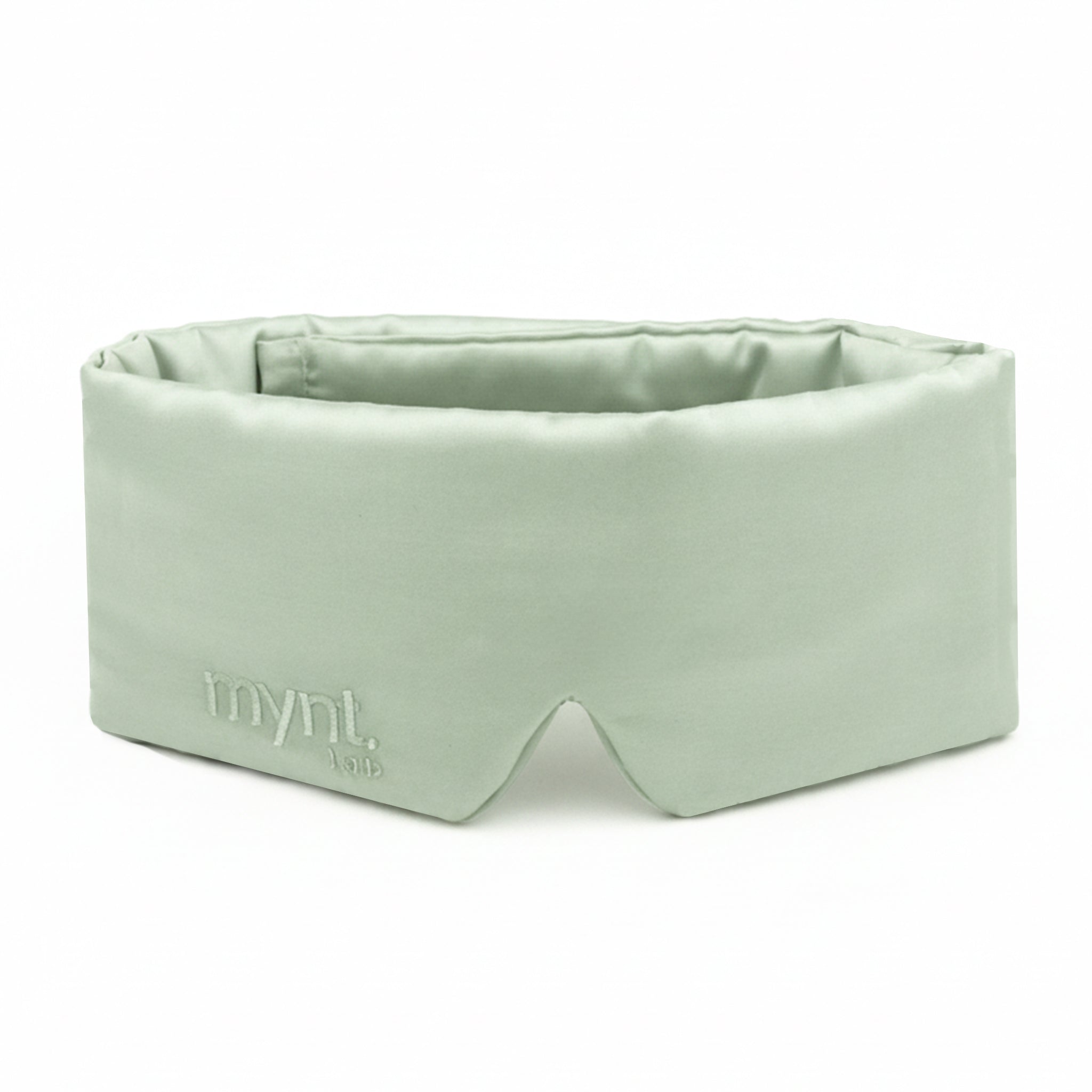 Sage green sleep mask with 'mynit lab' branding on a white background