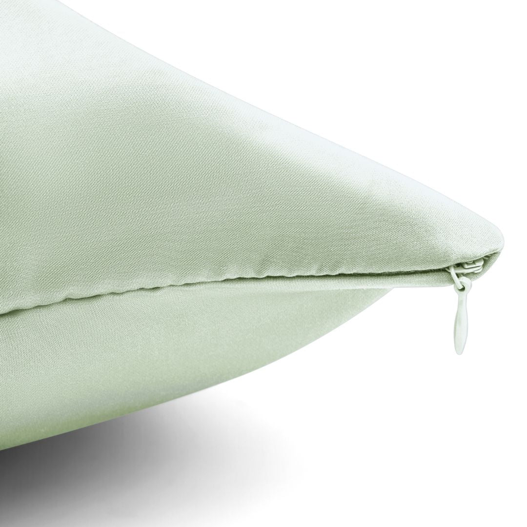 Sage green vegan silk pillowcase with hidden zipper, showing smooth texture and clean stitching details on plant-based fabric