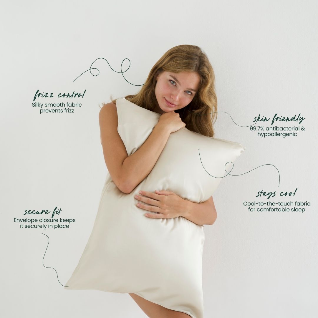 Woman holding a sand-coloured silky pillow with text about its features on a neutral background