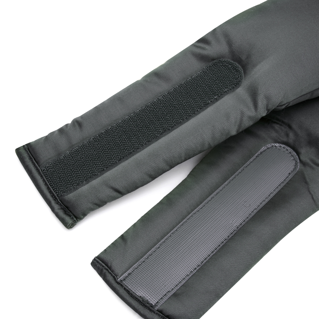 The Sleep Mask features two charcoal padded sleeves: one with a textured Velcro strip, the other with a smooth, ribbed strip. Made from durable materials, it blocks out light and offers comfort as a high-quality sleep mask.
