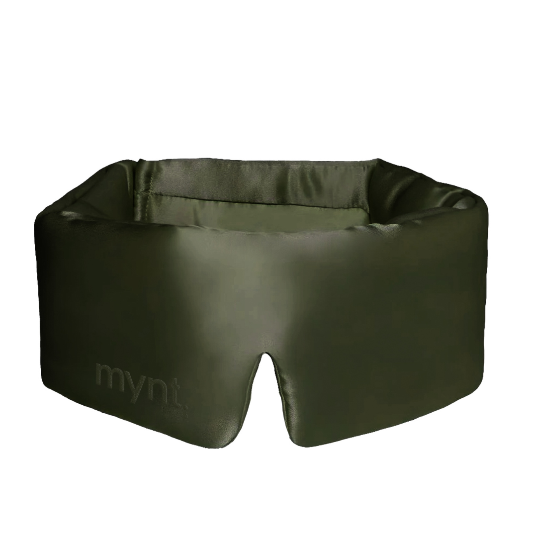 The Sleep Mask is dark green with "mynt lab" on the front, offering a wide, cushioned design and a centre notch at the bottom to block light and promote deep sleep.