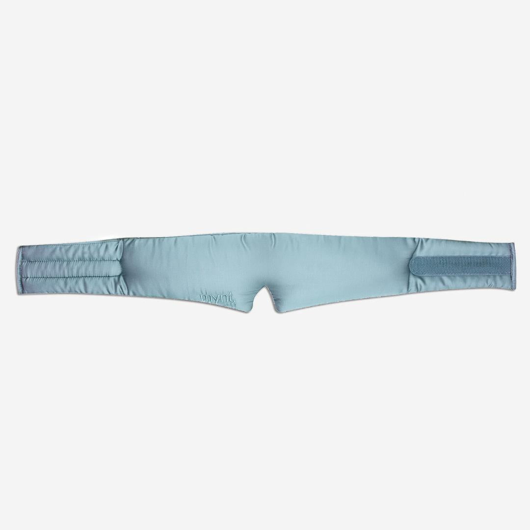The Sleep Mask is light blue, padded, and contoured with a nose opening and Velcro closures at both ends - ideal for blocking light and promoting deep sleep.