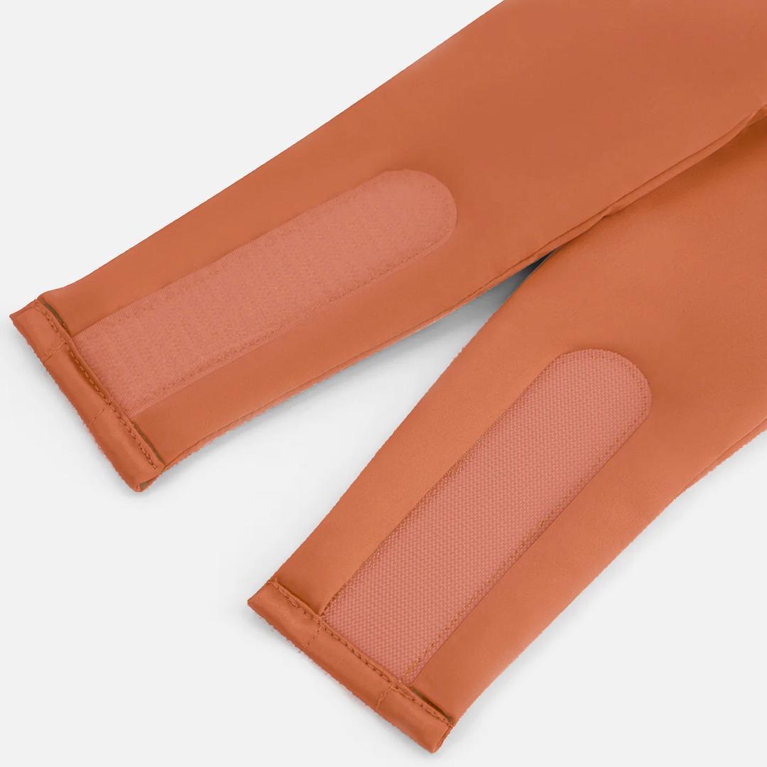 Close-up of a terracotta coloured sleep mask with adjustable velcro straps - perfect for relaxation, as the Sleep Mask blocks light for deep sleep.