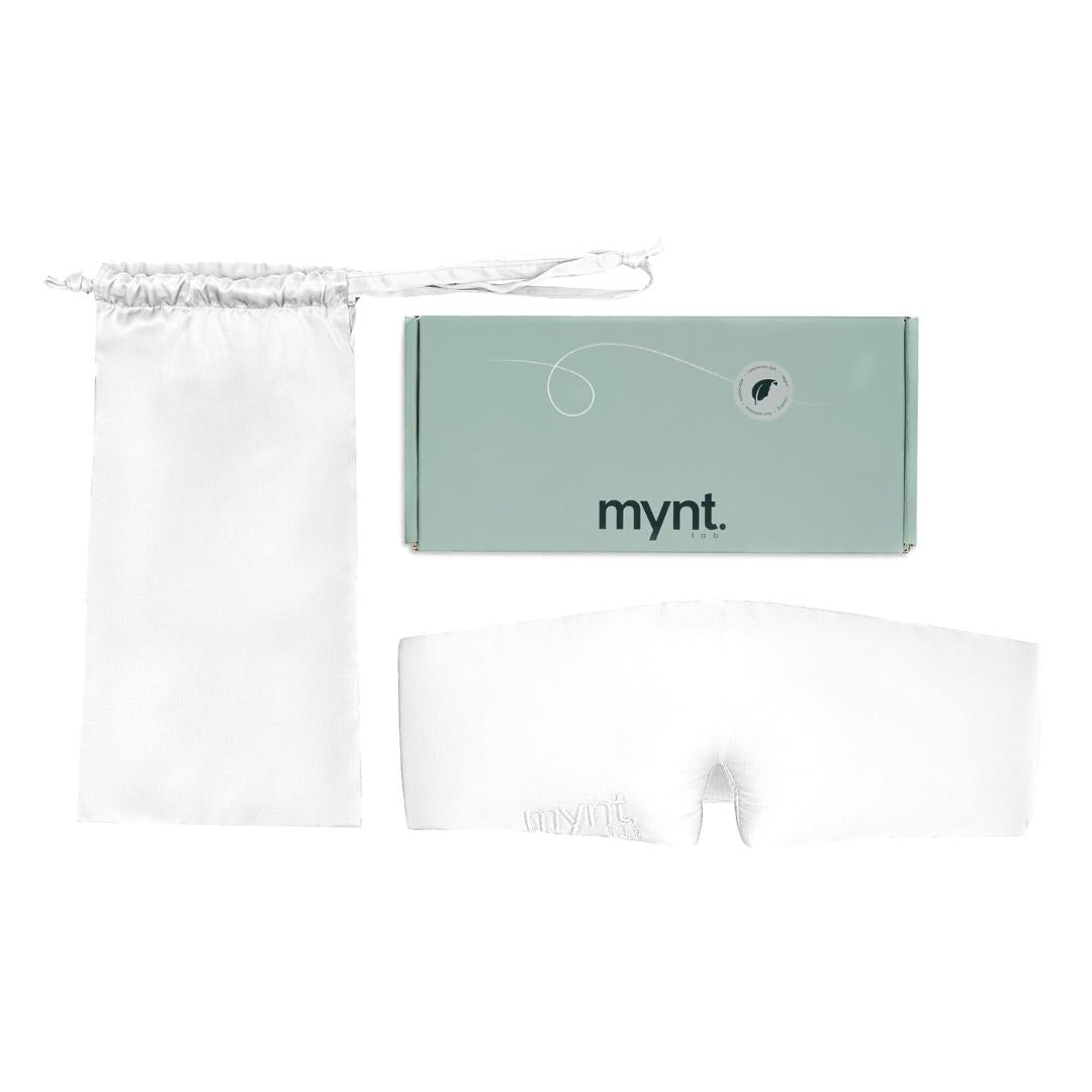 The Sleep Mask, a white silky mask for blocking light, comes with a matching drawstring pouch and is presented in a mint green mynt lab branded box - ideal for deep sleep and restful nights.