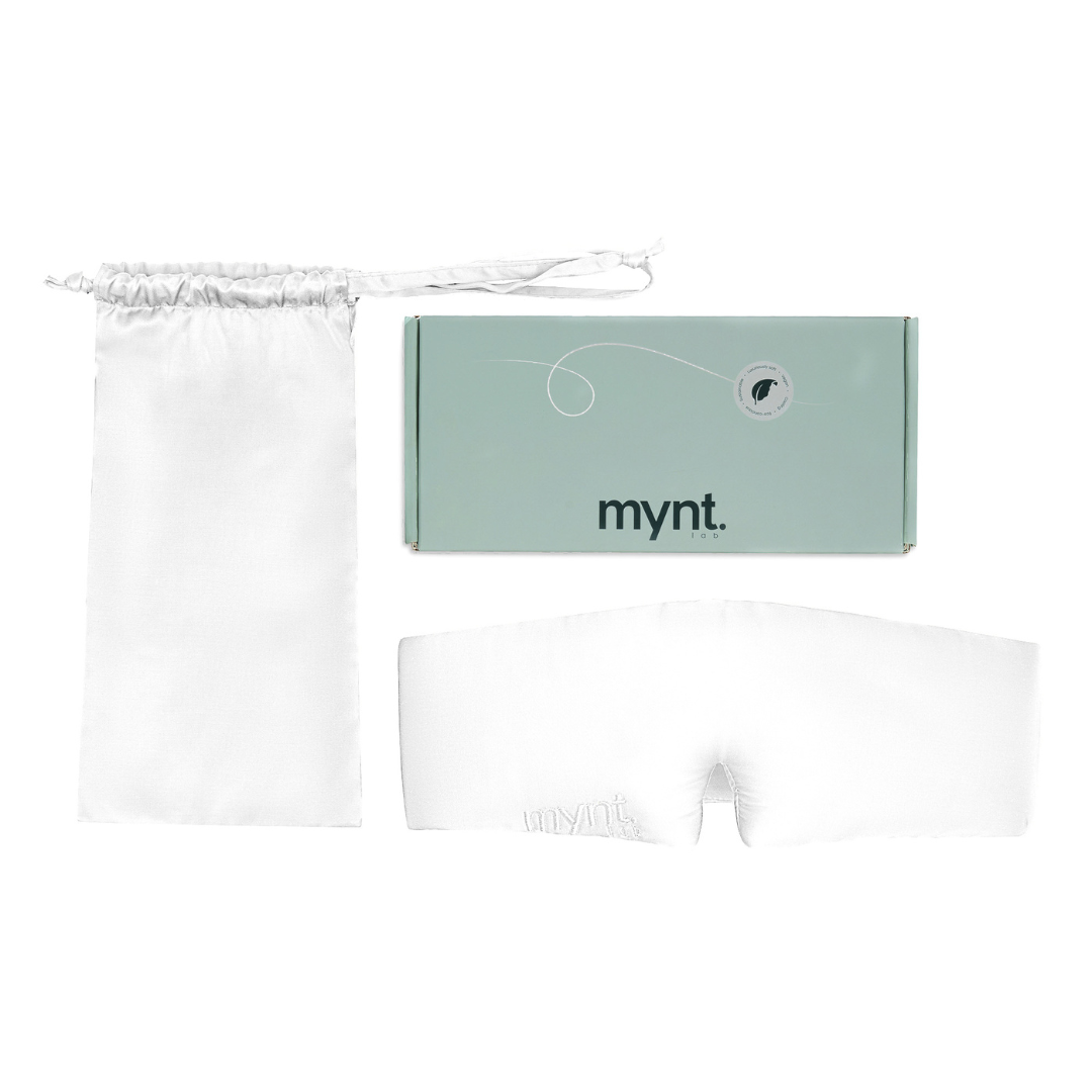 The Sleep Mask, a white silky mask for blocking light, comes with a matching drawstring pouch and is presented in a mint green mynt lab branded box - ideal for deep sleep and restful nights.
