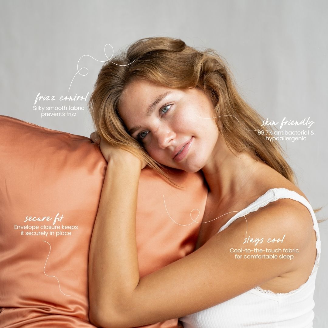 Woman holding a terracotta silky pillow with text about its features on a neutral background