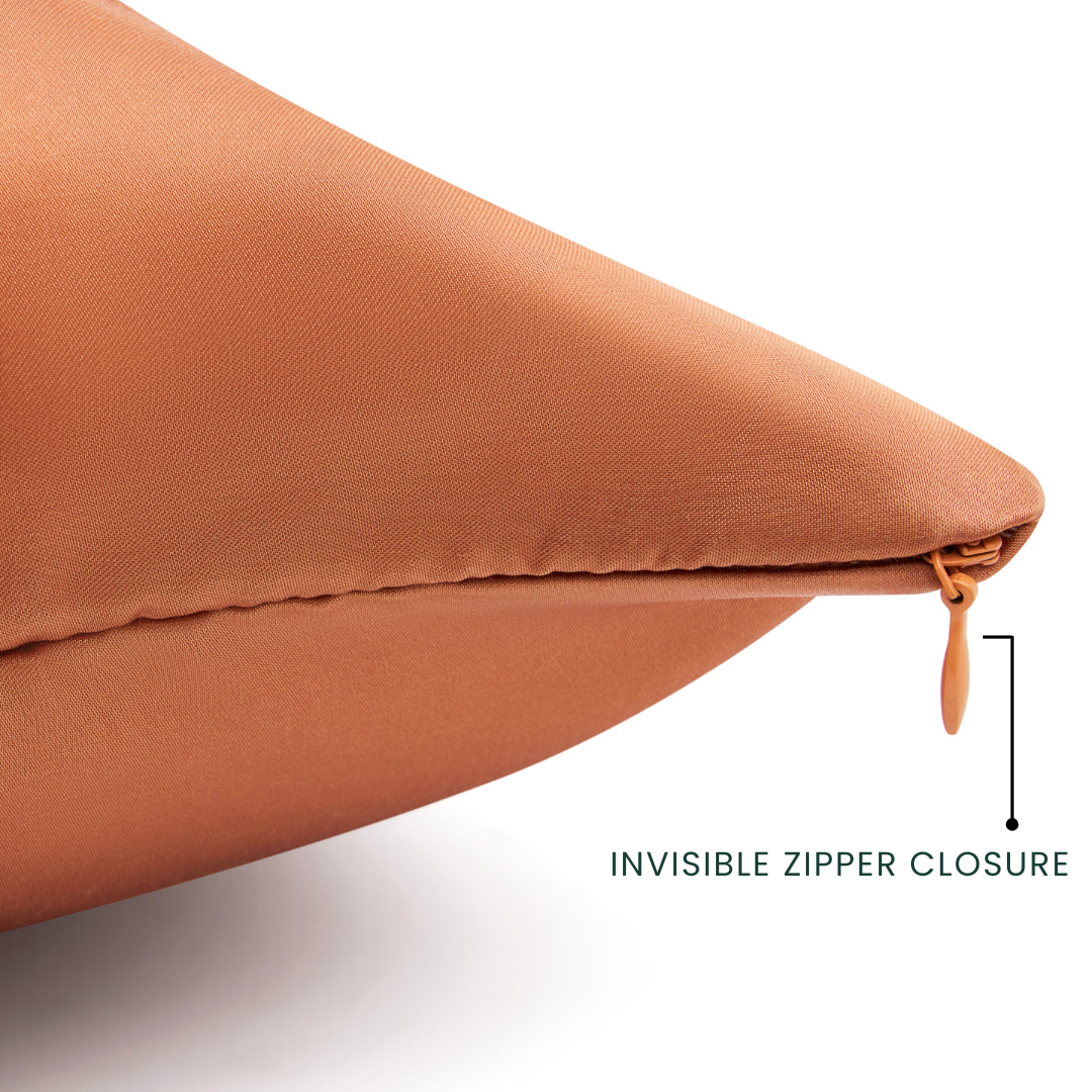 Terracotta pillow with an invisible zipper closure on a white background