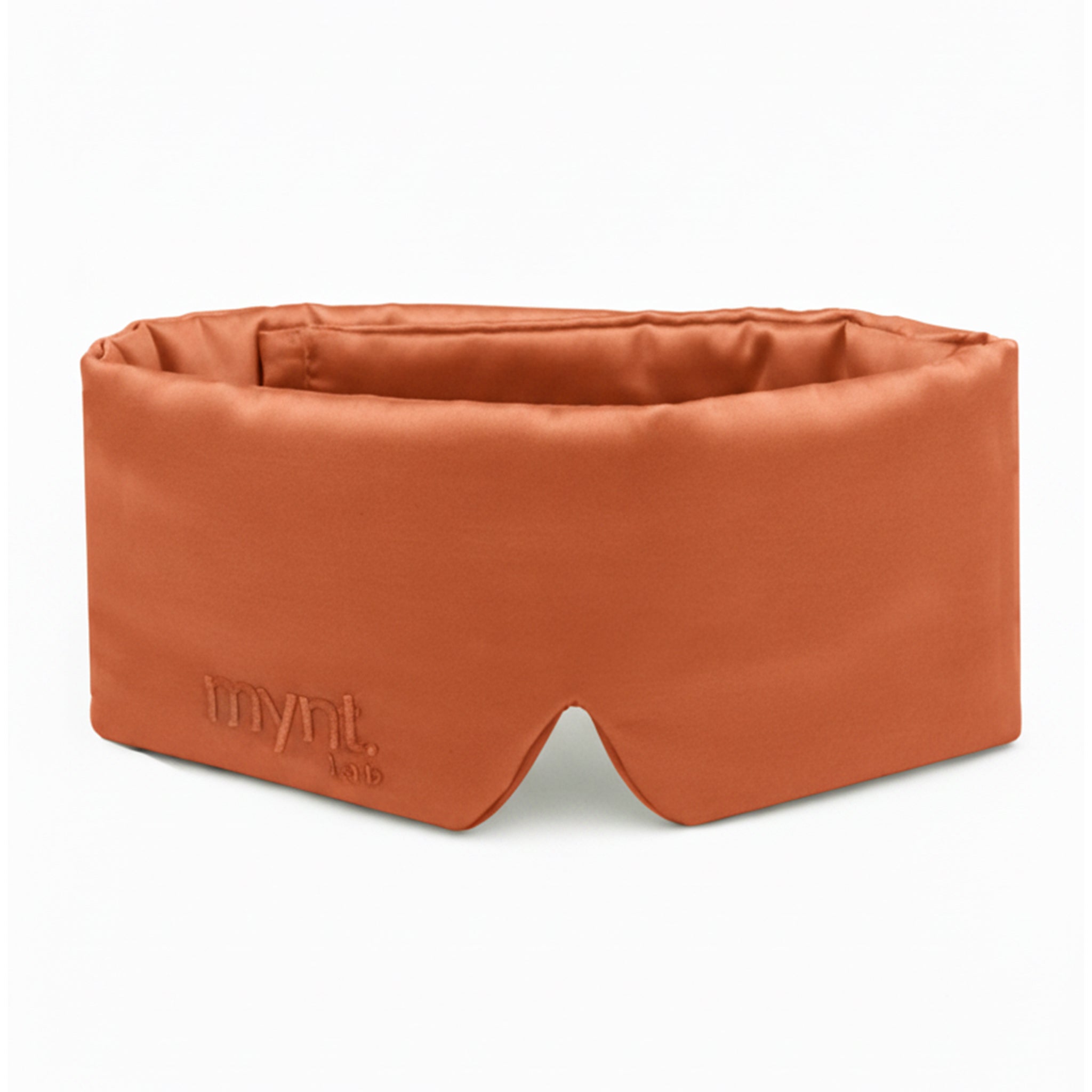 Terracotta sleep mask with 'mynt lab' branding on a white background