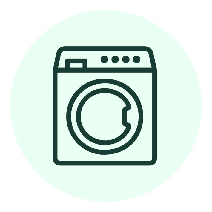 Simple line drawing of a front-loading washing machine, depicted with a circular door and control buttons, centered on a light green circle background.