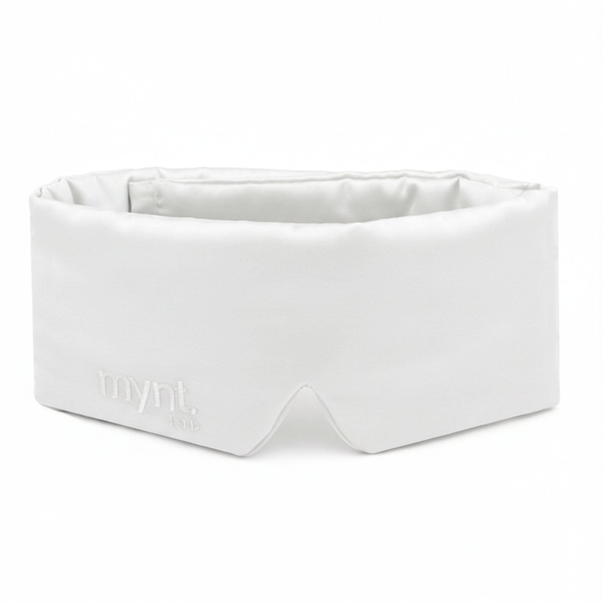 White sleep mask with 'mynt lab' embroidery text on a white background