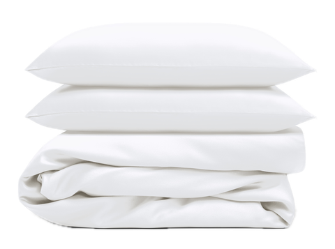 Existing white duvet cover set photograph, folded cover with two matching pillowcases on pillows